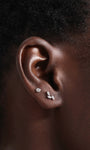 14K solid gold labret stud with round cubic zirconia and leaf design on ear, 18G.