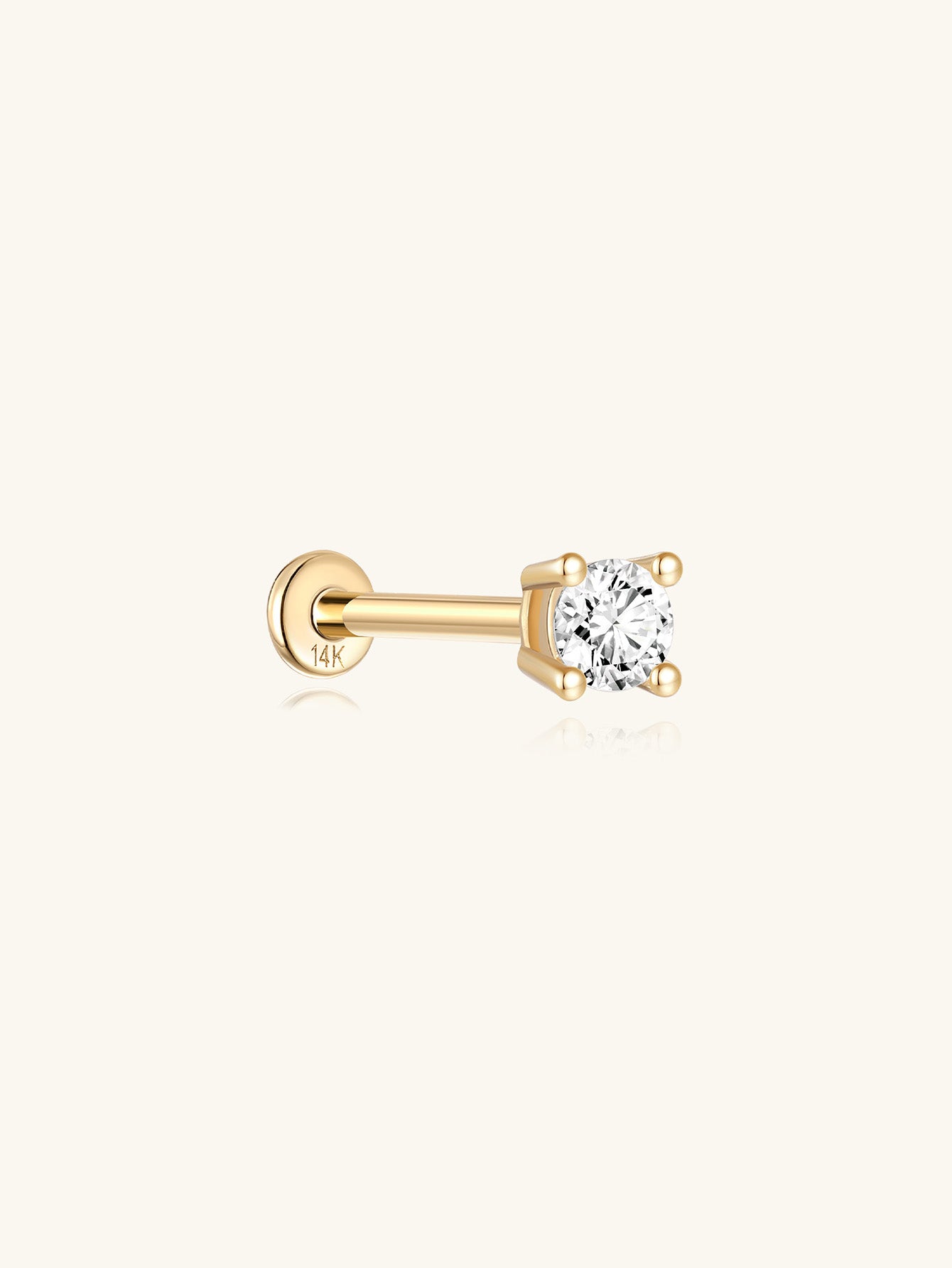 14K solid gold single stud earring with a sparkling cubic zirconia stone, featuring a flat back post stamped "14K".