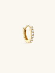 Single KOSINER minimalist pavé diamond clicker hoop in 14K solid yellow gold, seamless hinged closure, continuous row of sparkling faceted stones, clean minimalist product shot