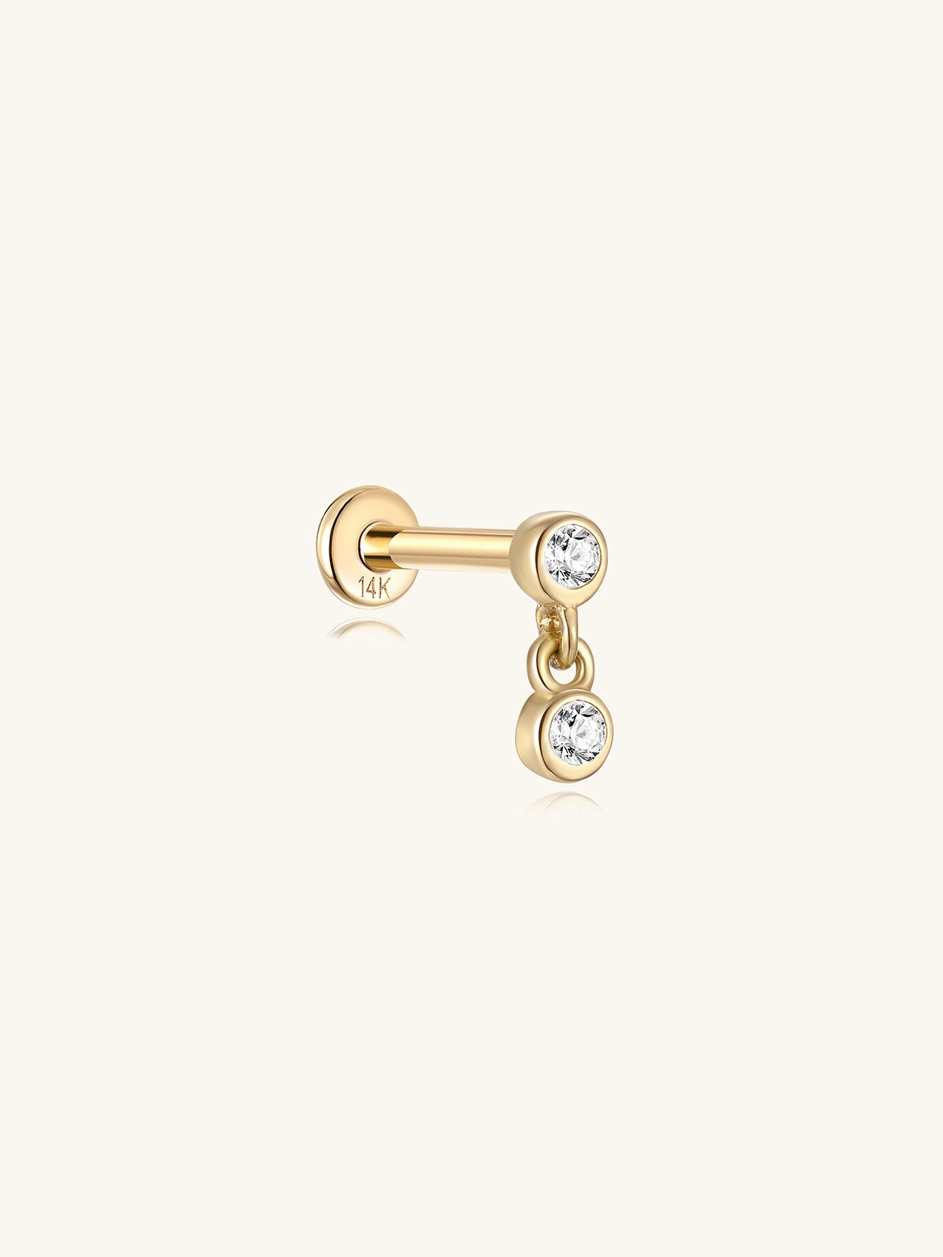 14K solid gold dangle piercing stud with two bezel-set cubic zirconia stones and flat back.
