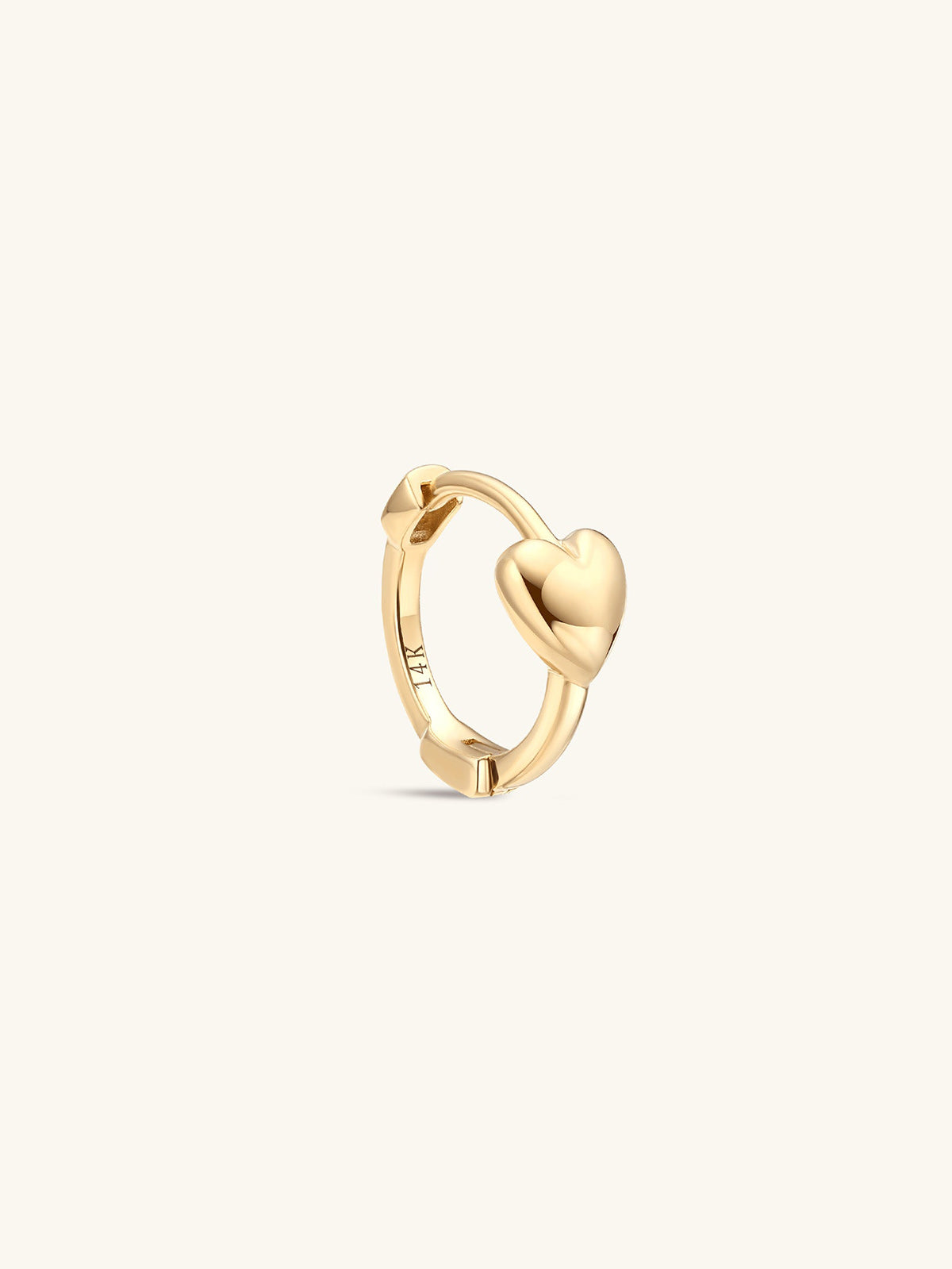 KOSINER gold heart hoop with a polished heart detail and hinged closure.