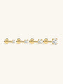Four 14K solid gold mini stud earrings with cubic zirconia stones and flat back posts, shown in different sizes.