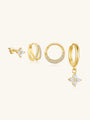 Four 18kt gold-plated sterling silver CZ earrings: stud, double hoop, segmented hoop, clover charm drop.