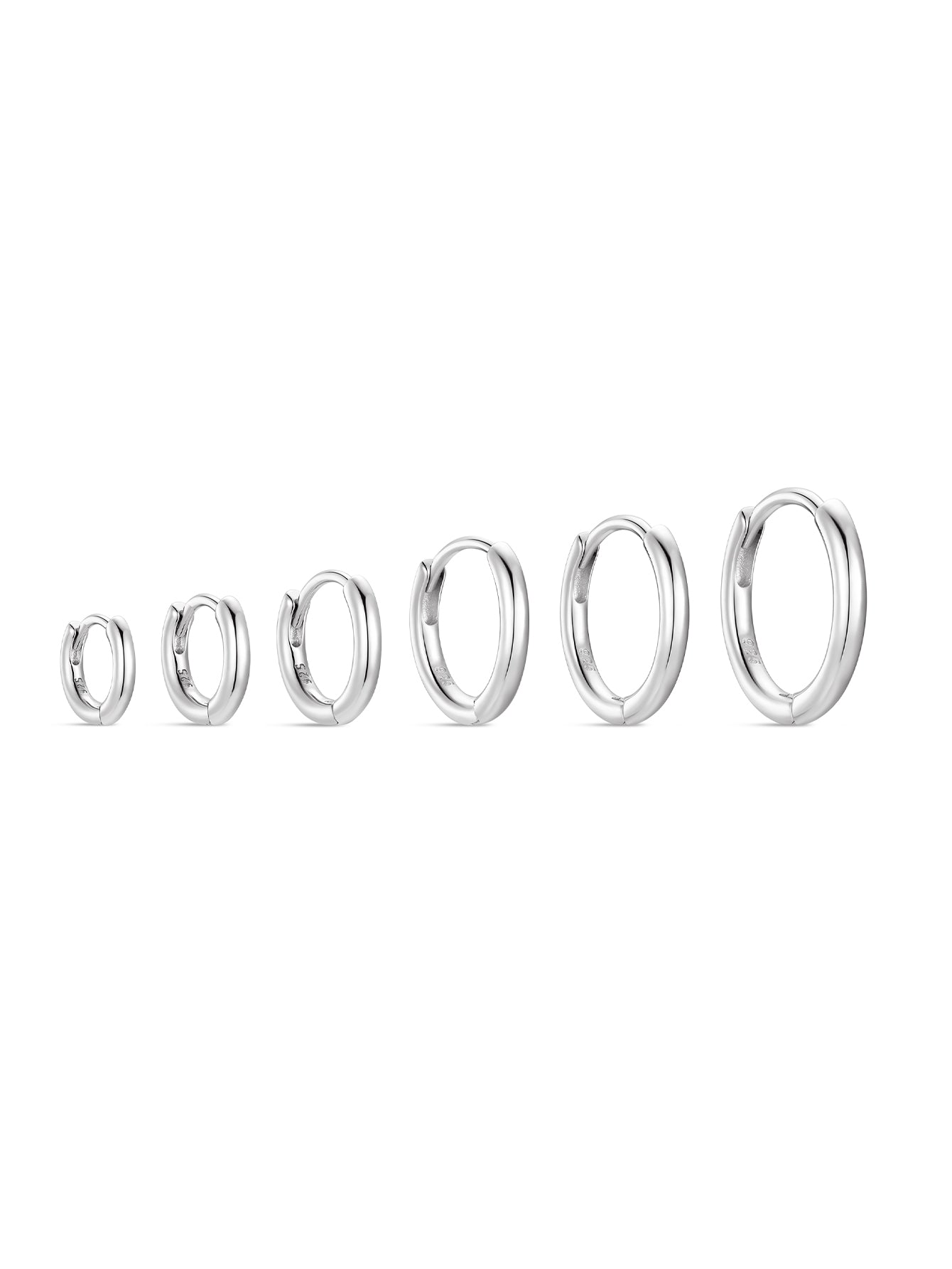 Six 925 sterling silver huggie hoop earrings in various sizes. Hypoallergenic and nickel-free for daily wear.