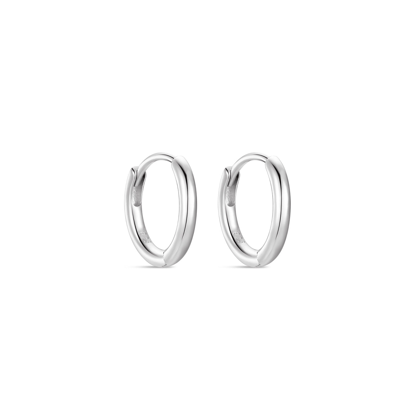 Pair of polished sterling silver huggie hoop earrings on white background, classic daily wear.