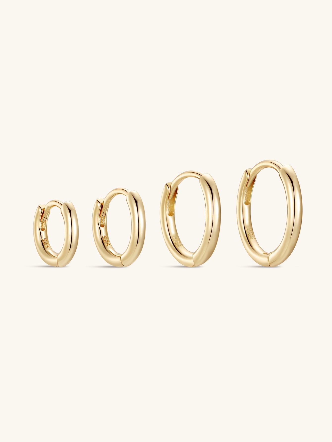 Four gold-plated 925 sterling silver hoop earrings in various sizes, ideal for daily casual wear.