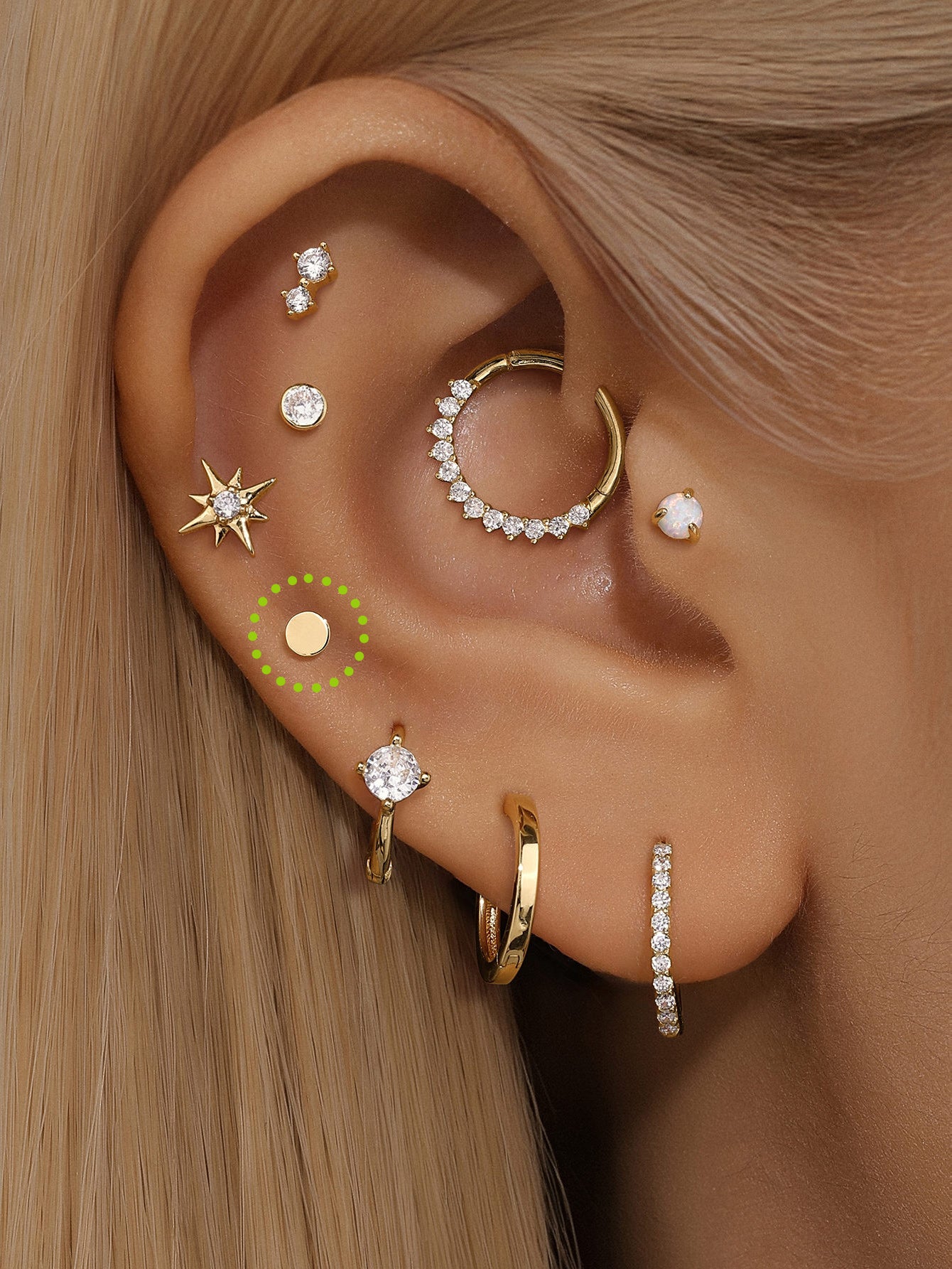 Ear styling featuring a 14K solid gold 3.5mm flat disc internally threaded labret stud and other gold piercings.