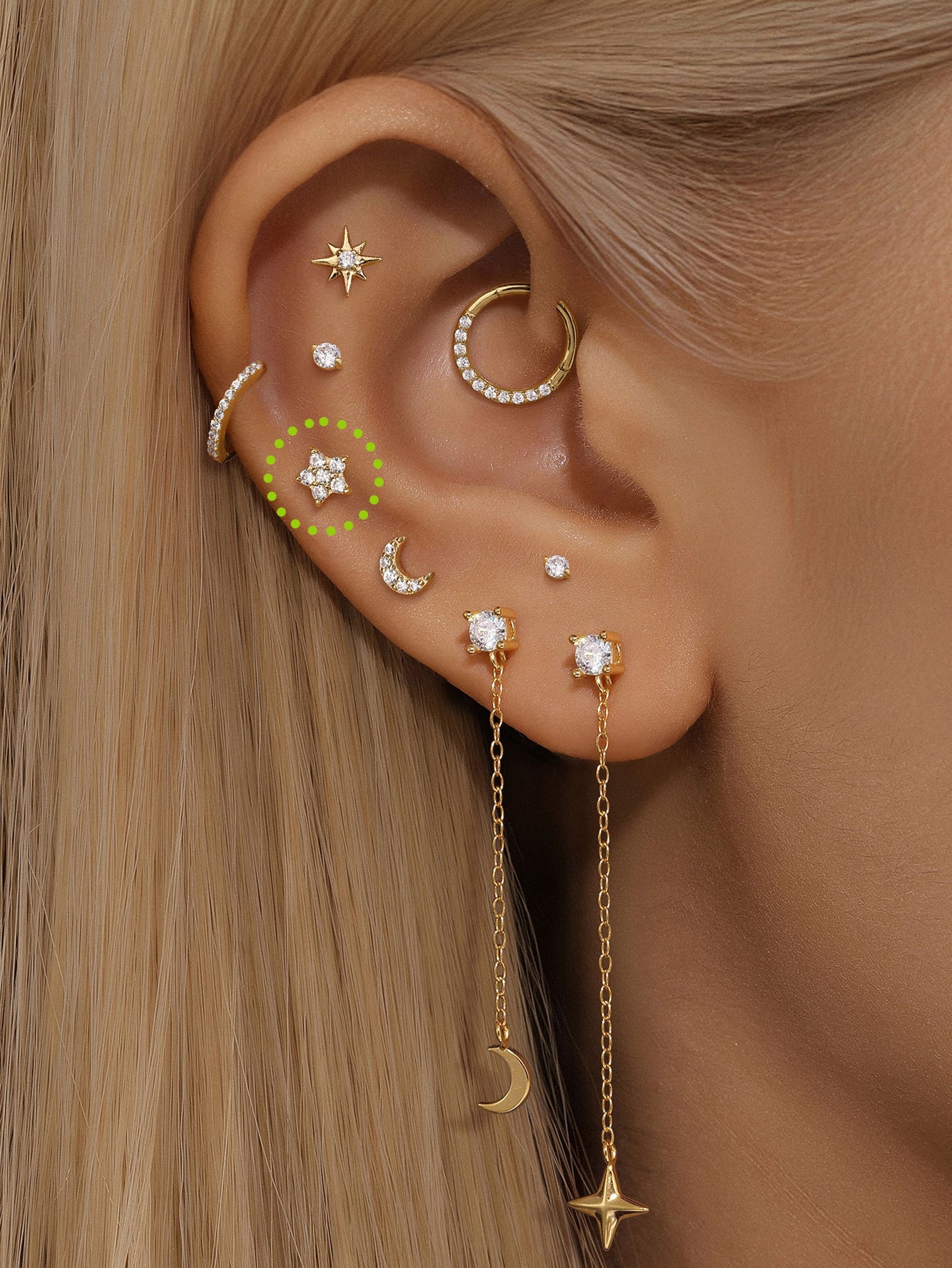 14K solid gold star stud earring with cubic zirconia, flat back labret post, shown styled on an ear piercing.
