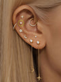 14K gold stud earring with 3.6mm CZ on ear, styled in a piercing stack.