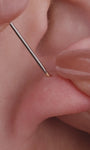 Layered ear stacking styling with KOSINER rainbow light piercing jewelry collection, triangular flower flat back studs matched with hoops for multi-position helix lobe tragus