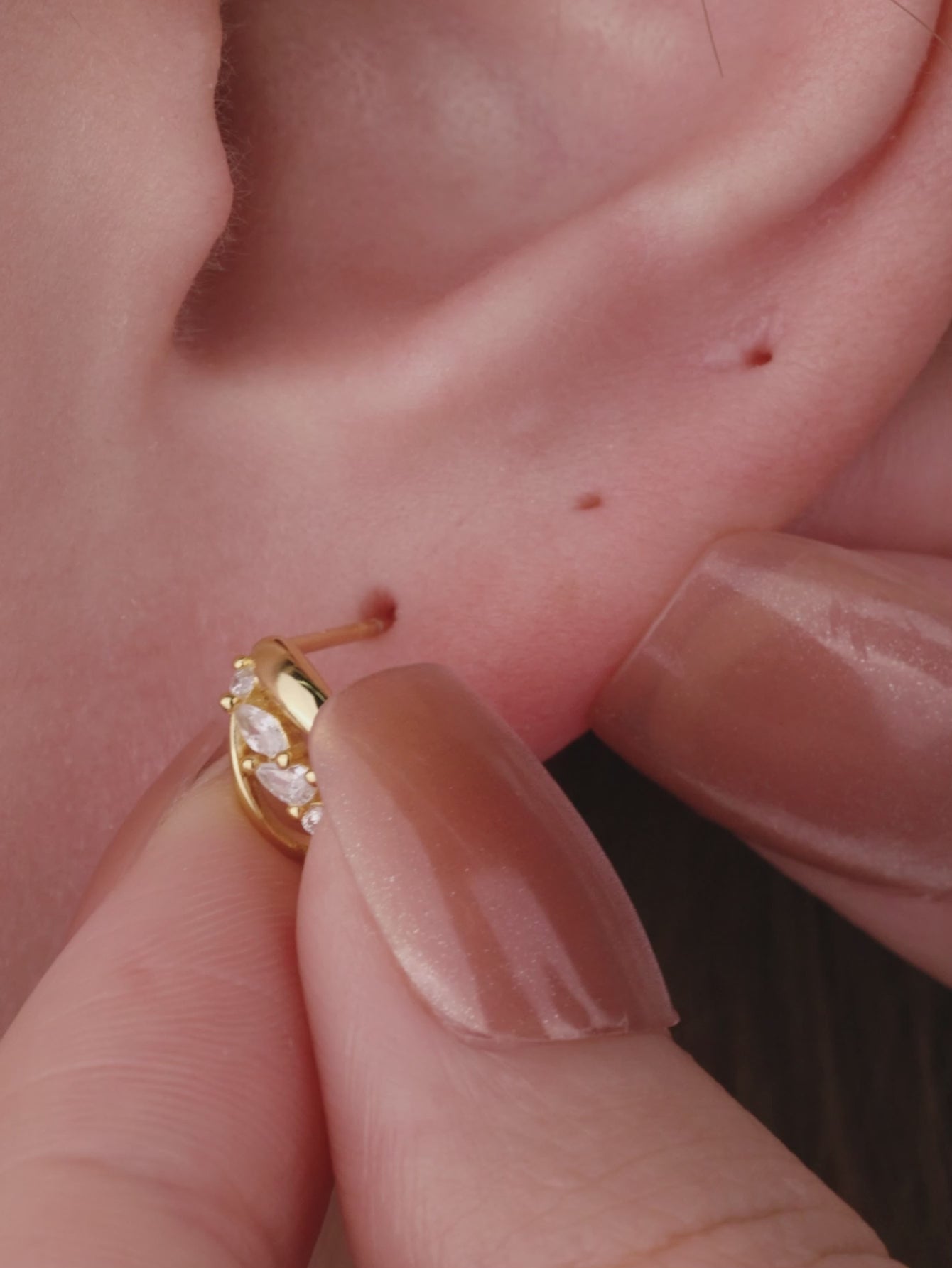 Ear stacking look with assorted KOSINER 14K solid gold flower cartilage piercing studs, multi-position helix lobe layered ear jewelry styling