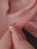 Ear stacking look with assorted KOSINER 14K solid gold flower cartilage piercing studs, multi-position helix lobe layered ear jewelry styling