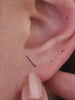 KOSINER starfish tassel stud styled on seashell, designed for layering and stacking
