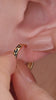Stylish layered full ear stacking aesthetic with KOSINER Puzzle two-tone bezel figure 8 flat back helix stud, paired triangular two-tone studs, two-tone pave hoop, tiny plain cz cartilage studs, contemporary contrast design multi-piercing ear styling