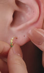 Layered full ear stack styling with KOSINER Gem Garden nature gem collection, peridot crown 14K gold flat back stud matched with aquamarine, multi-color teardrop and triangle gem cartilage piercings