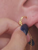 KOSINER Rising Star gold-plated chain earring on a cream display showing crescent moon details and an open ear cuff