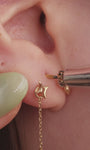 Curated ear stack with 14K solid gold trillion tassel dangle piercing stud on helix, minimalist gold layered ear jewellery