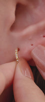 Edgy personalized full ear stacking look featuring KOSINER Prism spliced marquise flat back stud, matched spike dangle studs, chain conch piercing jewelry, pave cz helix piercings, modern sharp-line multi-position ear styling