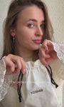 Model wearing KOSINER lotus marquise drop flat back stud in a gold ear stack