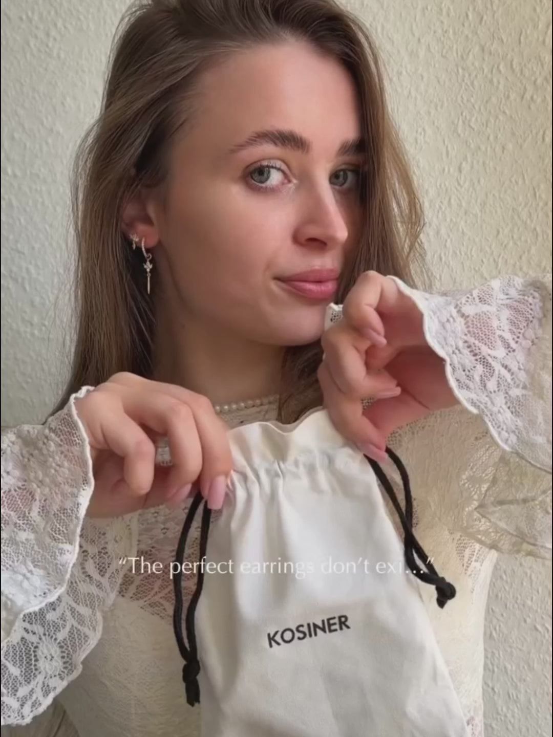 Model wearing KOSINER blooming lotus flat back stud in a gold ear stack