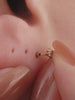 Ear stacking look with assorted KOSINER 14K solid gold marquise drop cartilage piercing studs, multi-position helix lobe layered ear jewelry styling