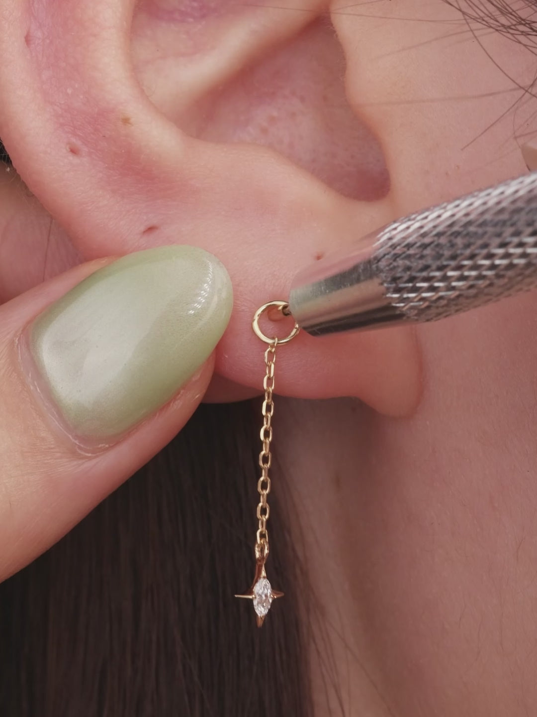 Model curated multi piercing ear styling, 14k gold long chain marquise star detachable dangle charm on gold hoop earring, layered celestial ear jewellery