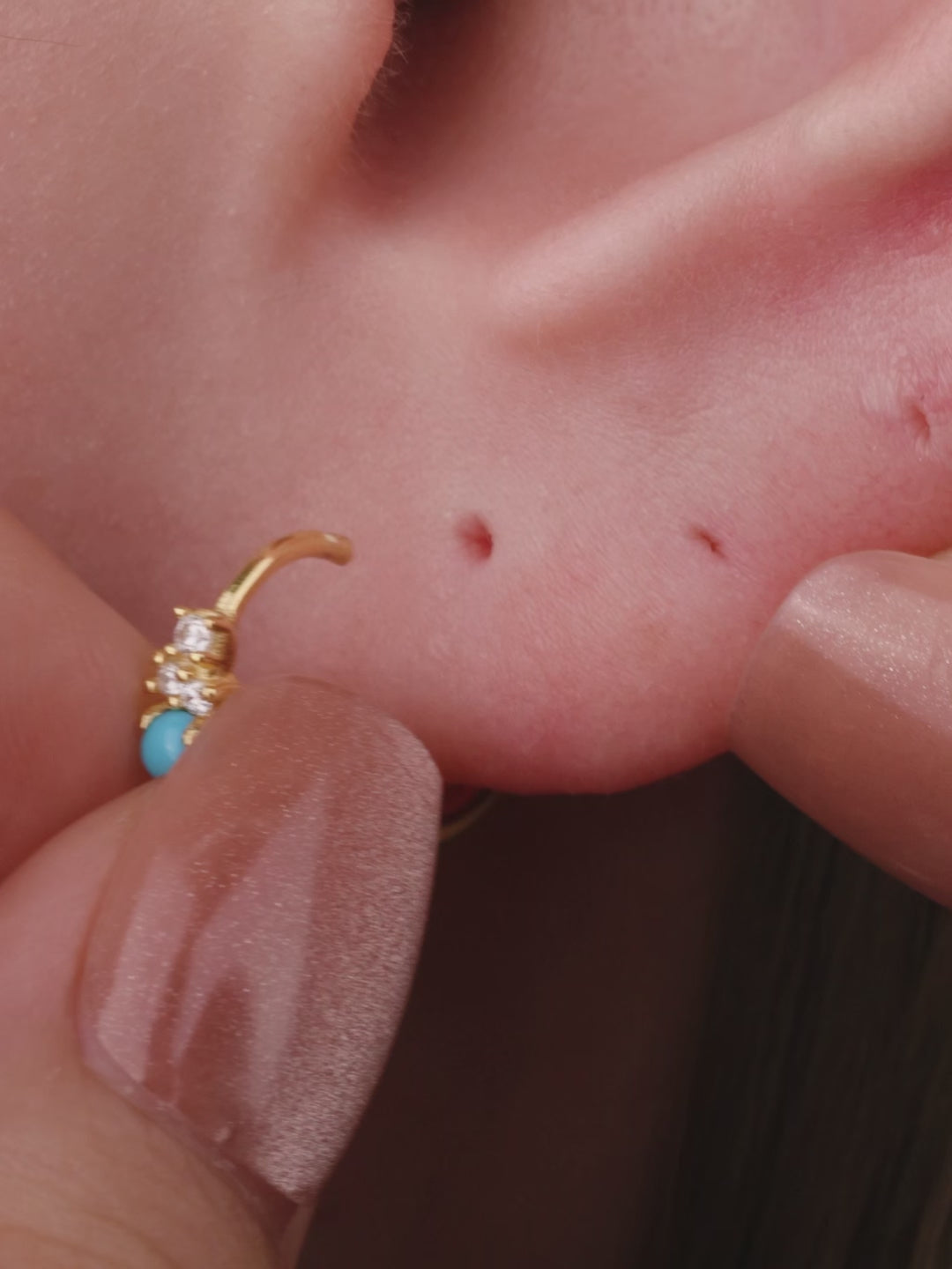 Elegant curated ear stacking look featuring KOSINER Étoile triangular flat back stud on earlobe, matched with sunburst, leaf, square gem studs and gold hoop rings, refined minimalist multi-piercing styling